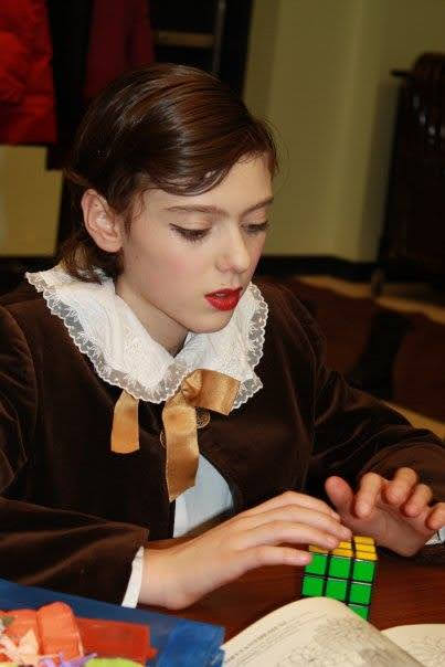 Gus in stage makeup for The Nutcracker with a Rubik's Cube in 2009